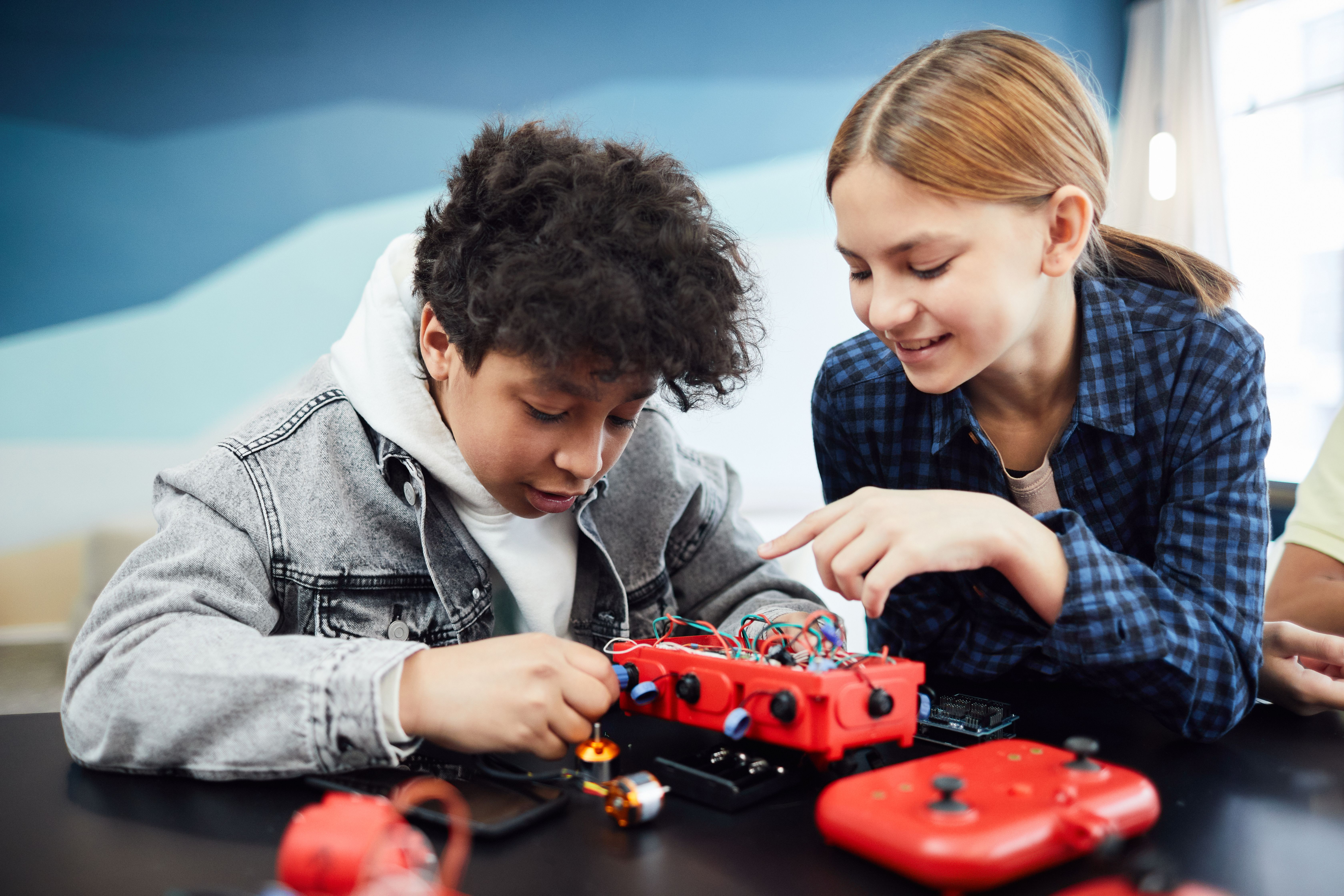 Kids working together on a robotics project