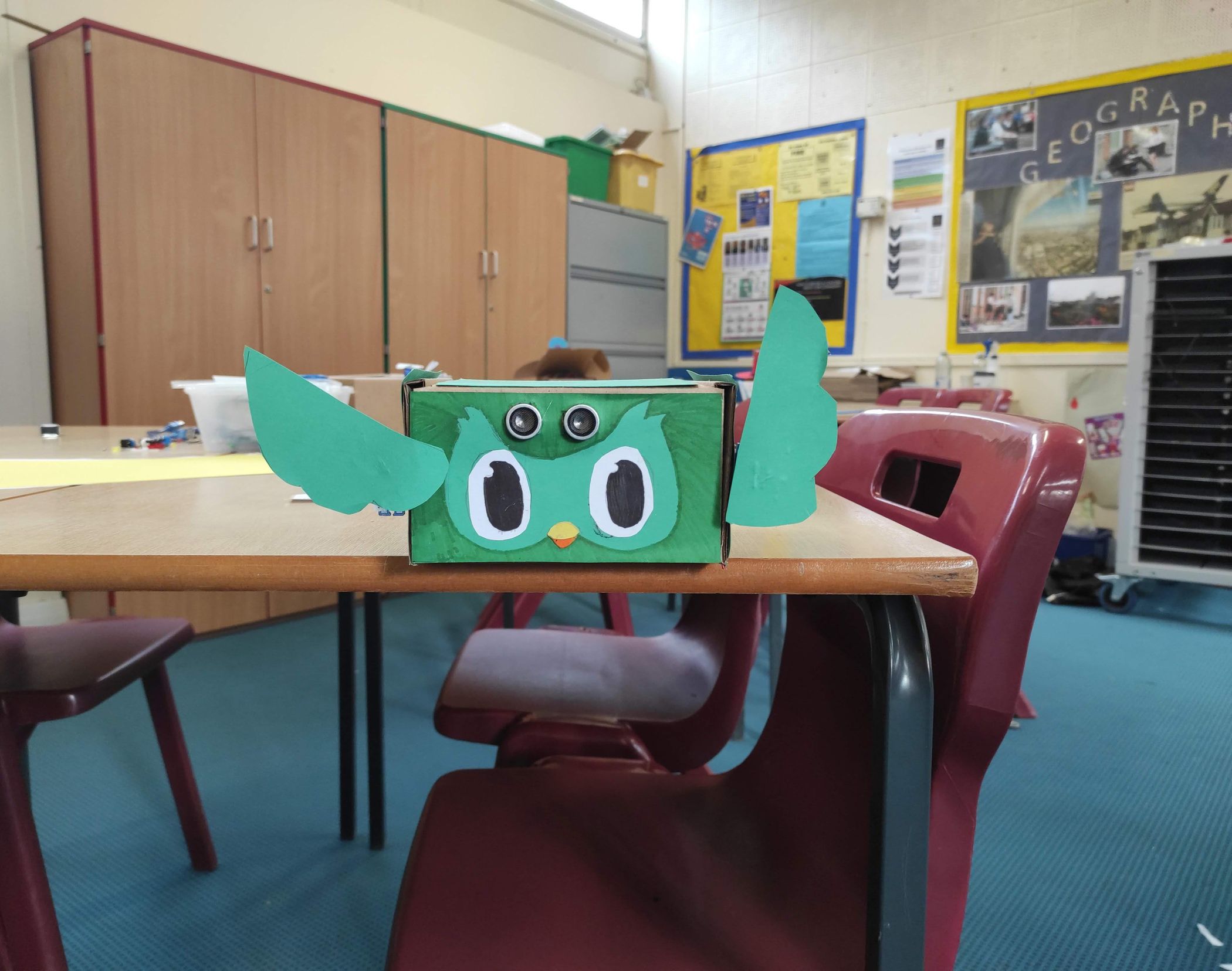 Kids building an Arduino-based robot project